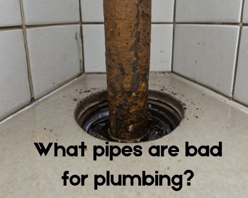 a rusty pipe going to drain