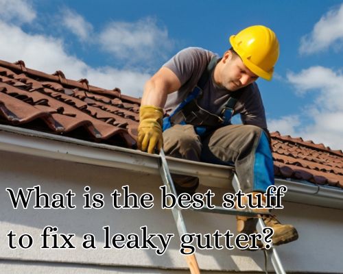 a roofer fixing leaky gutter